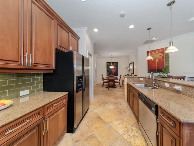 kitchen with pendant lighting, light tile floors, light stone countertops, appliances with stainless steel finishes, and sink