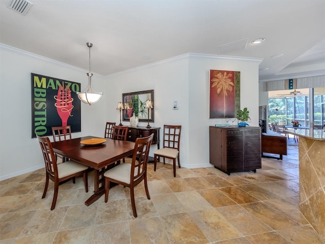 dining area with crown molding, ceiling fan, and light tile floors