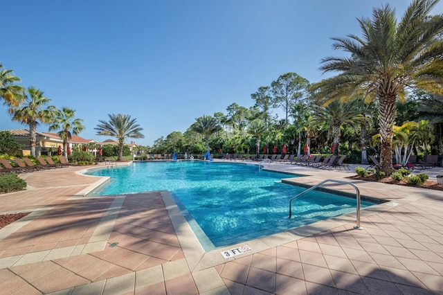 view of swimming pool with a patio area