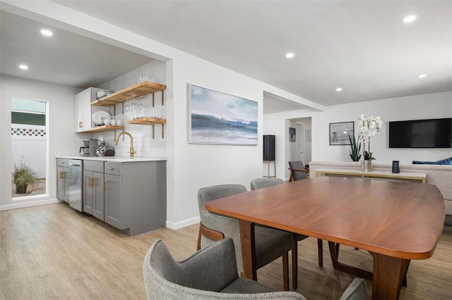 dining area featuring light hardwood / wood-style flooring and sink