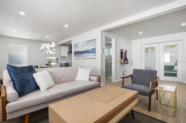 living room featuring light hardwood / wood-style flooring and french doors