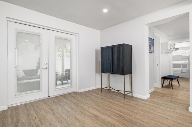 interior space featuring french doors and light hardwood / wood-style flooring