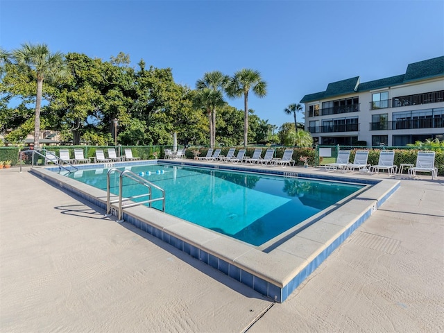 view of swimming pool featuring a patio area