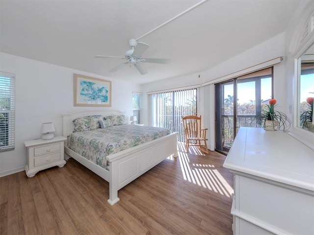 bedroom with ceiling fan, access to exterior, and light hardwood / wood-style flooring