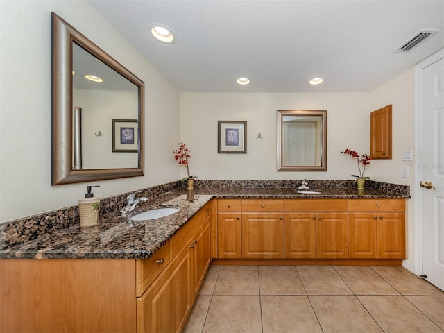 bathroom with vanity and tile patterned floors