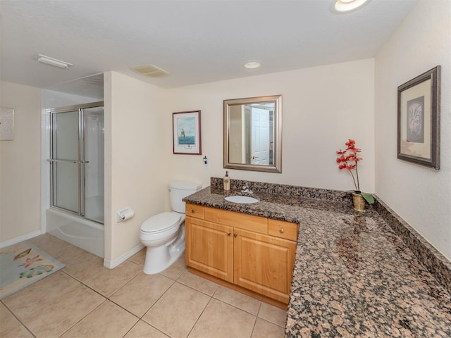 full bathroom with shower / bath combination with glass door, vanity, tile patterned floors, and toilet