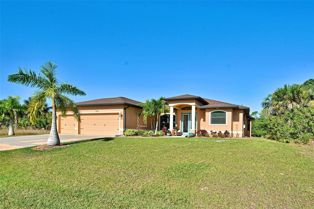 view of front facade with a front lawn and a garage