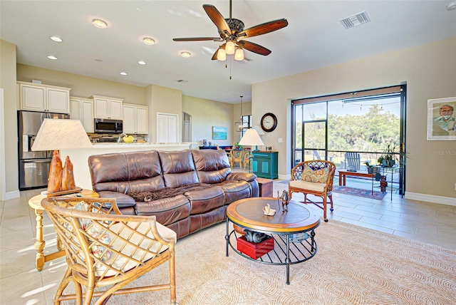 tiled living room with ceiling fan