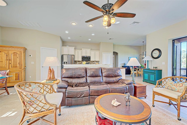 tiled living room with ceiling fan