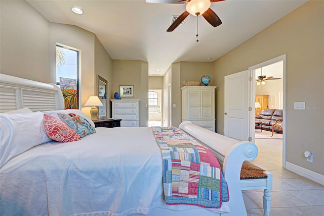 bedroom featuring multiple windows, ceiling fan, and light tile flooring