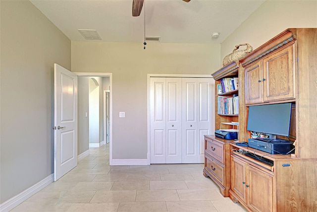 tiled office space with ceiling fan