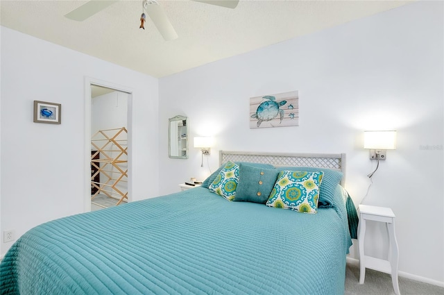 carpeted bedroom featuring a closet and ceiling fan