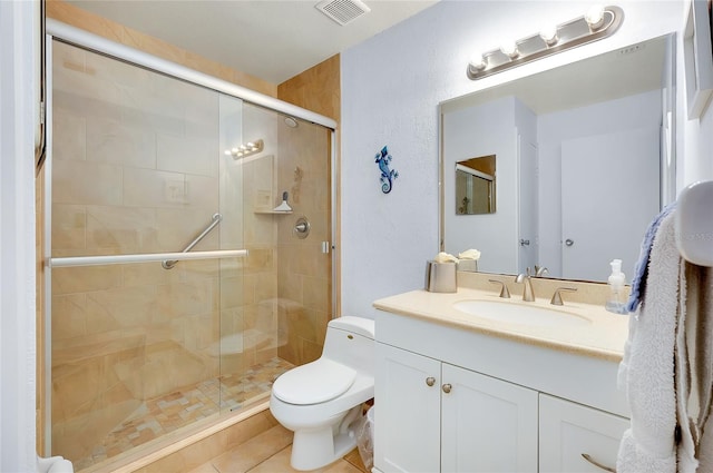 bathroom featuring oversized vanity, toilet, tile floors, and walk in shower