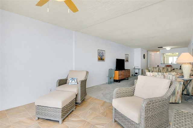 tiled living room featuring ceiling fan