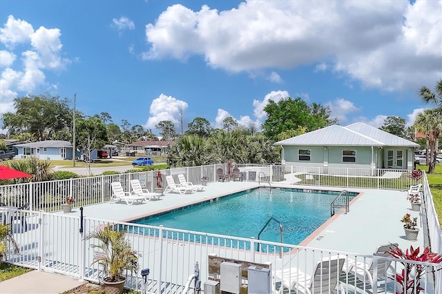 view of swimming pool with a patio area