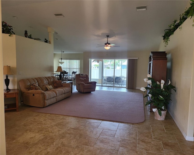 living room with tile floors and ceiling fan