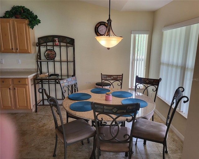 dining space featuring tile floors