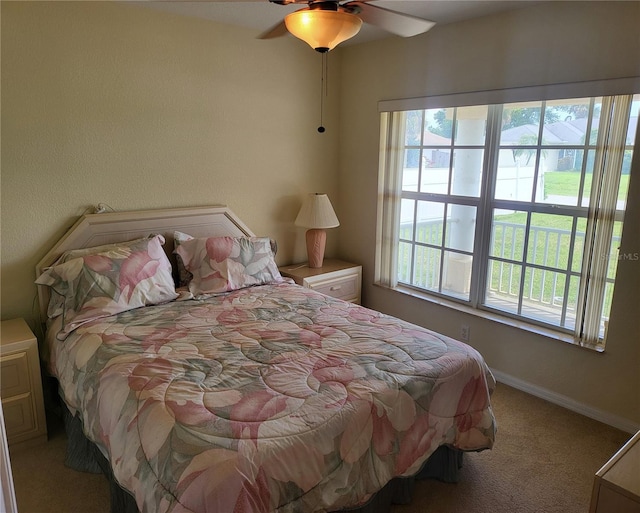 bedroom with light colored carpet and ceiling fan