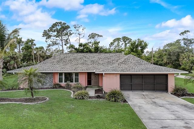 ranch-style house with a garage and a front yard