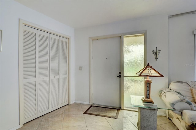 entrance foyer with light tile patterned floors