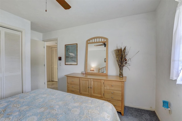 bedroom with a closet, carpet, and ceiling fan