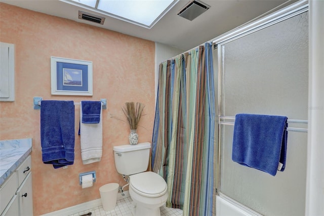 full bathroom featuring shower / bath combo with shower curtain, tile patterned floors, toilet, and vanity