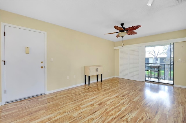 empty room featuring ceiling fan and light wood-type flooring