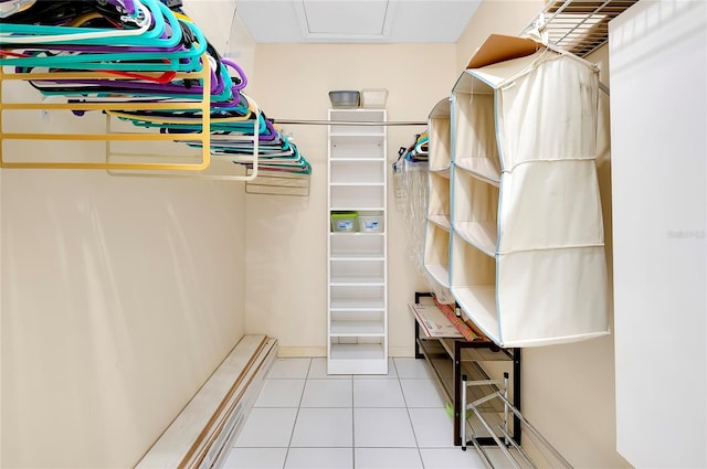 spacious closet with light tile flooring