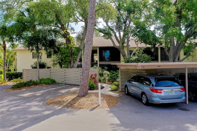 view of front of property featuring a carport