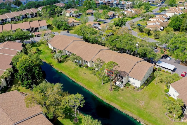 birds eye view of property with a residential view and a water view