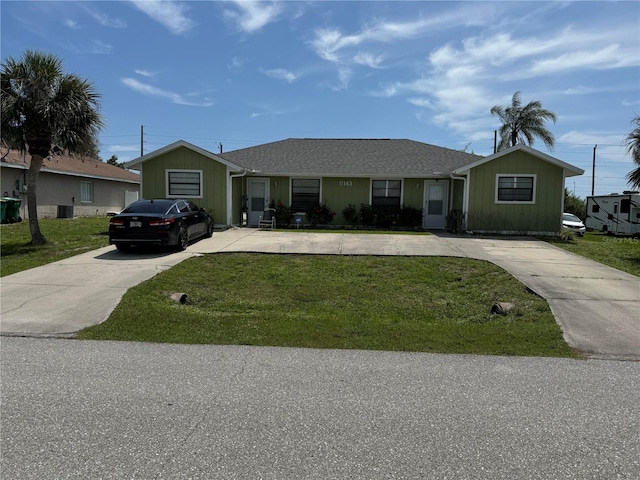 ranch-style home featuring a front yard