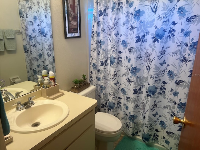 bathroom featuring toilet and oversized vanity