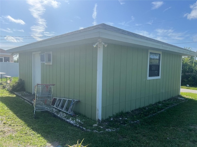 view of side of home featuring a yard