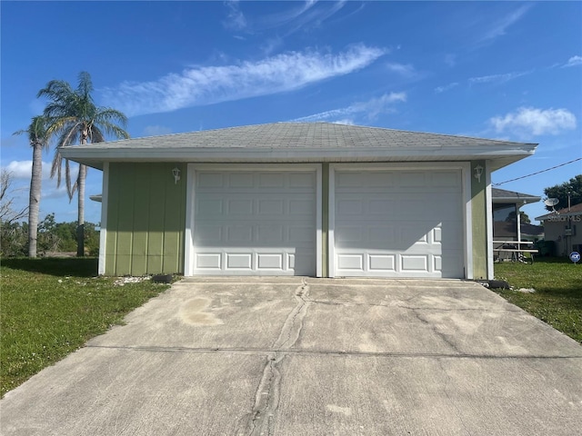 garage with a yard