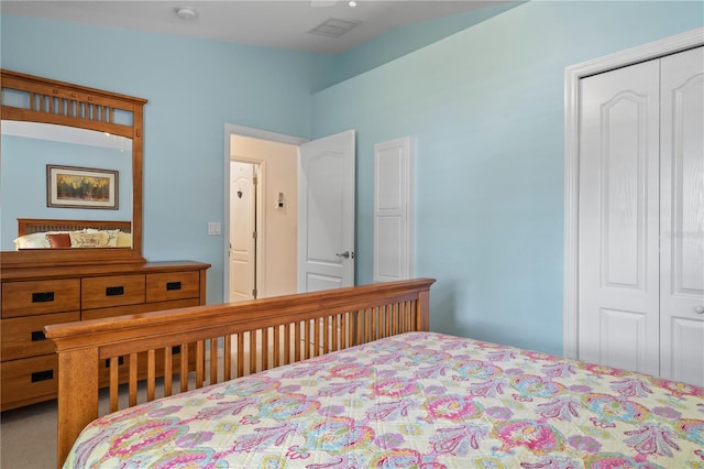 carpeted bedroom with a closet