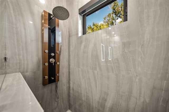 bathroom with tiled shower