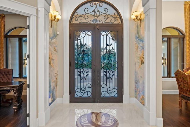 foyer entrance with plenty of natural light and french doors