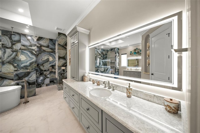 bathroom with vanity and ornamental molding