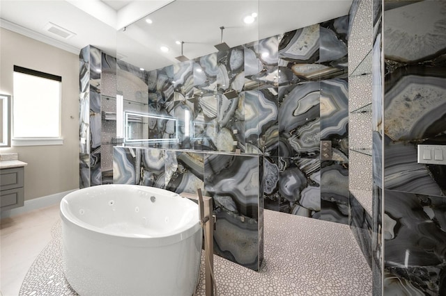 bathroom with vanity and a tub to relax in