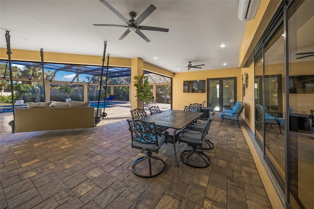 view of patio / terrace with a wall unit AC, glass enclosure, and ceiling fan