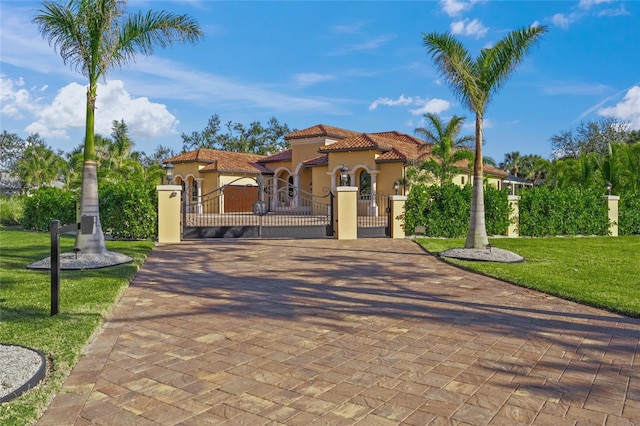 mediterranean / spanish house with a front yard