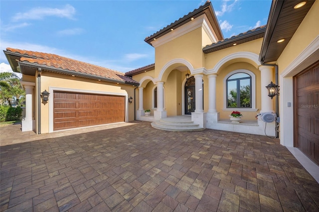 view of front of property with a garage