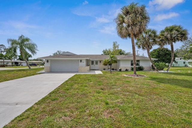 ranch-style home featuring a garage and a front lawn