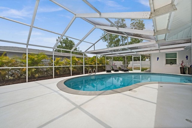 view of swimming pool with a patio and a lanai