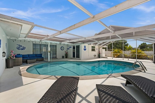 view of pool featuring outdoor lounge area, a patio, and a lanai