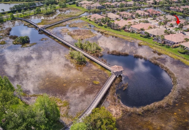 drone / aerial view with a water view