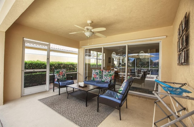 sunroom / solarium with ceiling fan