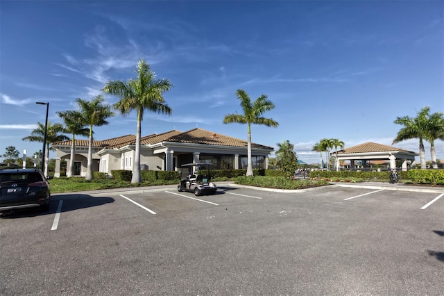 view of parking / parking lot featuring a gazebo