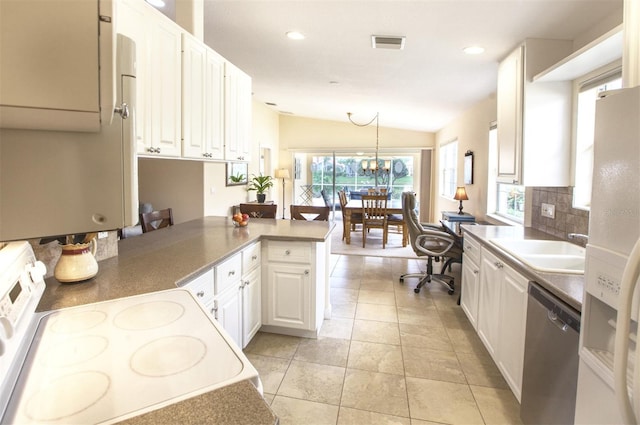 kitchen with pendant lighting, white cabinetry, dishwasher, range, and kitchen peninsula