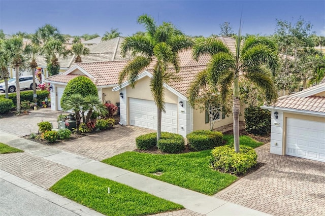 mediterranean / spanish-style house with a garage